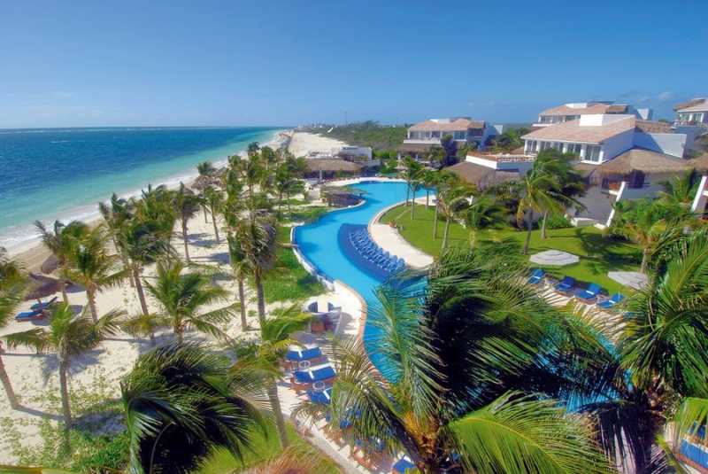 Aerial view of the beach and pool at Desire Pearl